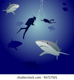 Scuba divers in the sea, surrounded by marine predators-sharks