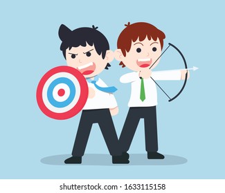 SD Business Man stand and holding a shield in the form of a target And colleagues held a bow fight together