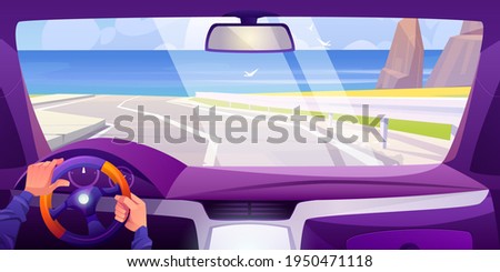 Sea beach view from car interior through windshield. Vehicle salon inside with hands on steering wheel and dashboard. Vector cartoon landscape of highway, ocean shore, mountains and seagulls