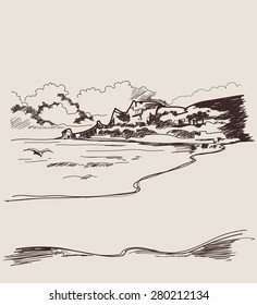Sea coast with clouds and mountains in the background