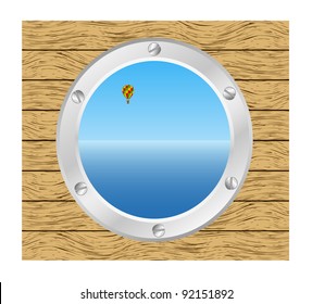 Sea and Hot air balloon in a silver ship window - porthole in a wooden wall