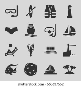 Sea icons set. set of 16 sea filled icons such as fish, crab, lighthouse, cargo ship, palm, boat, snorkel, rowing, man laying in the sun, man swim wear, aqualung, life vest