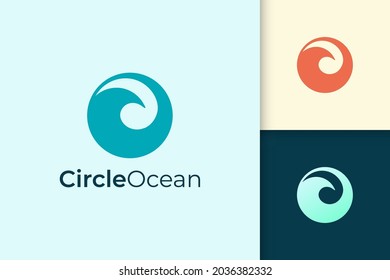 Sea or ocean logo in simple circle shape represent beach or surfing