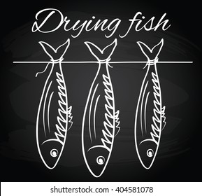 Sea roach. Stockfish. Drying fish on the chalkboard background