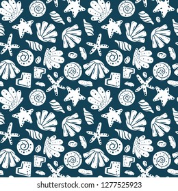 Sea shells, rocks, sand on the coast. Seamless pattern in blue and yellow. For pattern fills, wallpaper, print for clothes, wrapping paper