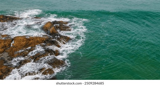  sea waves breaking on the rocks background 