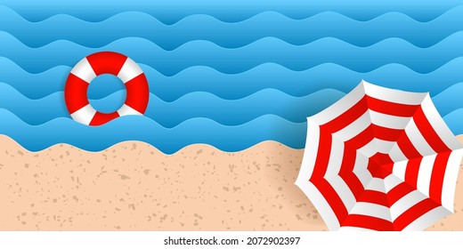 Seacoast landscape. Lifebuoy in sea waves and beach umbrella. Top view of the sandy beach