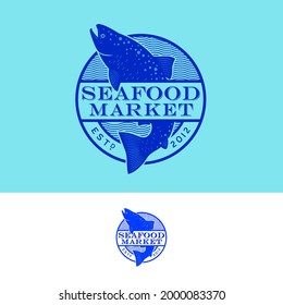 Seafood emblem. Blue silhouette of salmon fish in round sign.
Emblem for seafood market or restaurant, fresh fish and seafood, fast delivery.
