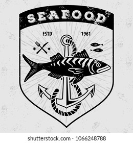 Seafood logo with fish and fishing rods . Vintage badge design. Vector illustration. 