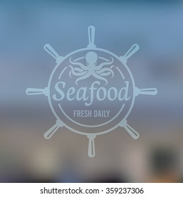 Seafood vector label, emblem or logo isolated on blurred background, restaurant menu design elements, nautical steering wheel with octopus vintage label