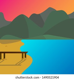 seafront c bridge and the sand. Mountains on background. Sunset. Blue sea.