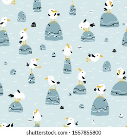 Seagulls on the stones. Vector seamless pattern in hand drawn scandinavian cartoon style. The illustration in a limited palette is ideal for printing on fabric, textiles, wrapping paper for children.