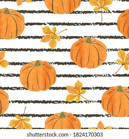 Seamless abstract autumn pattern with watercolor pumpkins and leaves. Striped background