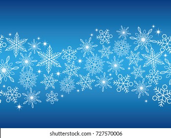A seamless abstract blue winter background with white snowflakes, vector illustration.