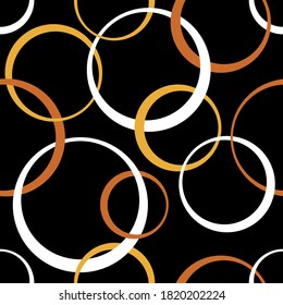 Seamless abstract circles pattern on black background.Vector design for fashion prints and backgrounds. EPS10 Illustration.
