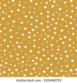 seamless abstract confetti pattern. mustard background. little white hearts and stars. vector texture. trend print for textiles and wallpaper.
