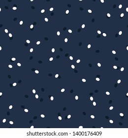 Seamless abstract dots pattern with blue and white dots on midnight blue background. Easily change colors.