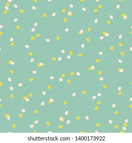 Seamless abstract dots pattern with yellow and white dots on green background. Easily change colors.