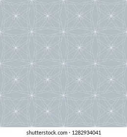 Seamless abstract floral pattern. Geometric flower ornament on a blue background.