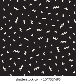 Seamless abstract geometric pattern in retro memphis style. Scatteres shapes vector trendy background.
