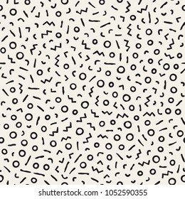Seamless abstract geometric pattern in retro memphis style. Scatteres shapes vector trendy background.