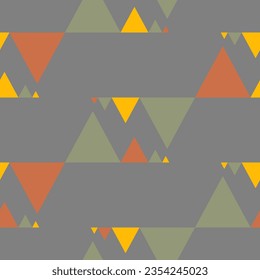 Seamless abstract geometric pattern. Yellow, green, brown, grey. Vector illustration. Polygons, triangles texture. Design for textile fabrics, wrapping paper, background, wallpaper, cover.