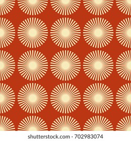 Seamless abstract geometrical pattern with stylized spiny circles or solar emblems. Beige stars on terracotta red background. Optical art ethnic style.