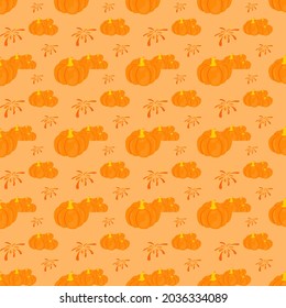 Seamless abstract graphics of pumpkins and fireworks on orange background. Creative vector design for fabrics, wraps, textiles, wallpaper, apparel for autumn.