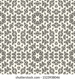 Seamless abstract halftone background. A minimal geometric pattern with triangles of various sizes. Lattice. Vector design element.