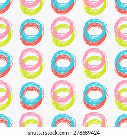 Seamless abstract  hand drawn brushstroke shapes pastel colored pattern texture . Simple  geometric circles fabric  design .
