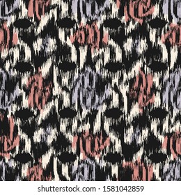 Seamless abstract ikat pattern with colorful strokes.
