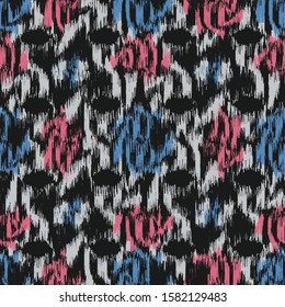 Seamless abstract ikat pattern with colorful strokes.
