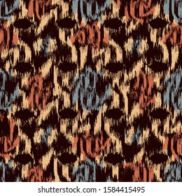 Seamless abstract ikat pattern with colorful strokes.
