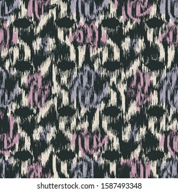 Seamless abstract ikat pattern with colorful strokes.
