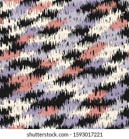 Seamless abstract ikat pattern with colorful strokes.
