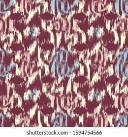 Seamless abstract ikat pattern with colorful strokes.
