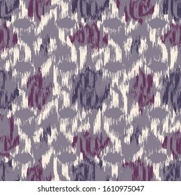 Seamless abstract ikat pattern with colorful strokes.
