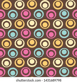 Seamless abstract ikat pattern with the image of rings and circles.
