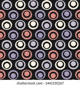 Seamless abstract ikat pattern with the image of rings and circles.
