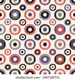 Seamless abstract ikat pattern with the image of rings and circles.
