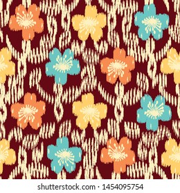 Seamless abstract ikat pattern with the image of floral ornament.
