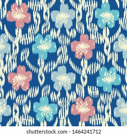 Seamless abstract ikat pattern with the image of floral ornament.
