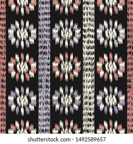 Seamless abstract ikat pattern with the image of floral ornament.
