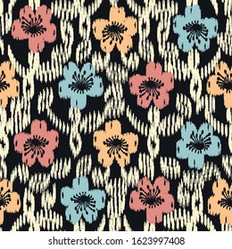 Seamless abstract ikat pattern with the image of floral ornament.
