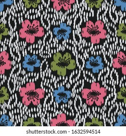 Seamless abstract ikat pattern with the image of floral ornament.