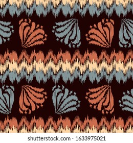 Seamless abstract ikat pattern with the image of floral ornament.
