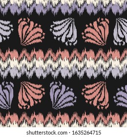 Seamless abstract ikat pattern with the image of floral ornament.
