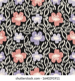 Seamless abstract ikat pattern with the image of floral ornament.
