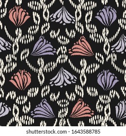 Seamless abstract ikat pattern with the image of floral ornament.
