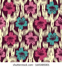Seamless abstract ikat pattern with the image of floral ornament.

